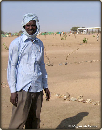 Daoud in front of what was then a "classroom" in a refugee camp in Eastern Chad