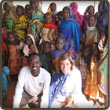Daoud, Megan and a group a refugees at camp in Eastern Chad