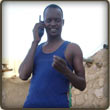 Daoud talking to one of his many contacts on a satellite phone in Darfur